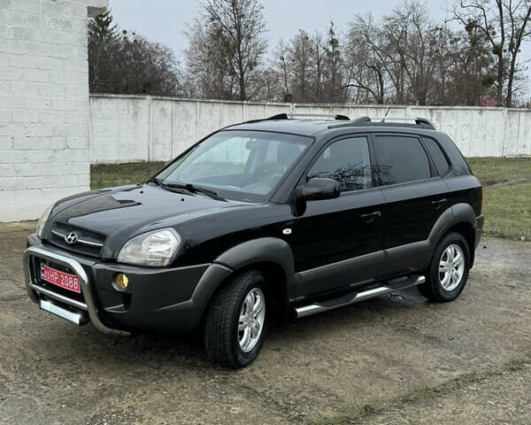 Черный Хендай Туксон, объемом двигателя 2 л и пробегом 201 тыс. км за 7750 $, фото 11 на Automoto.ua