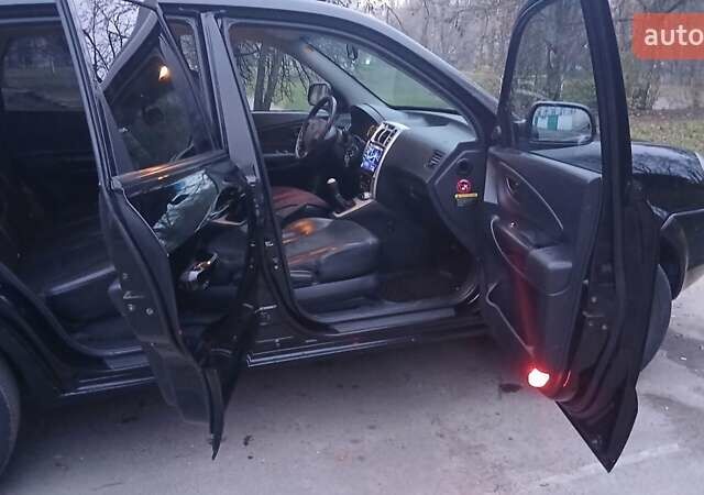 Черный Хендай Туксон, объемом двигателя 1.98 л и пробегом 320 тыс. км за 6300 $, фото 18 на Automoto.ua