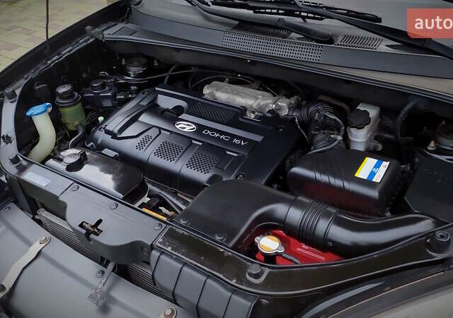 Чорний Хендай Туксон, об'ємом двигуна 2 л та пробігом 229 тис. км за 8600 $, фото 145 на Automoto.ua