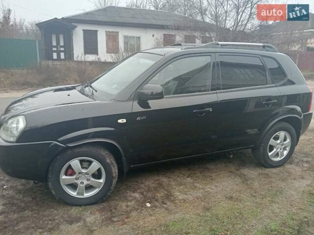 Черный Хендай Туксон, объемом двигателя 1.99 л и пробегом 235 тыс. км за 9000 $, фото 5 на Automoto.ua