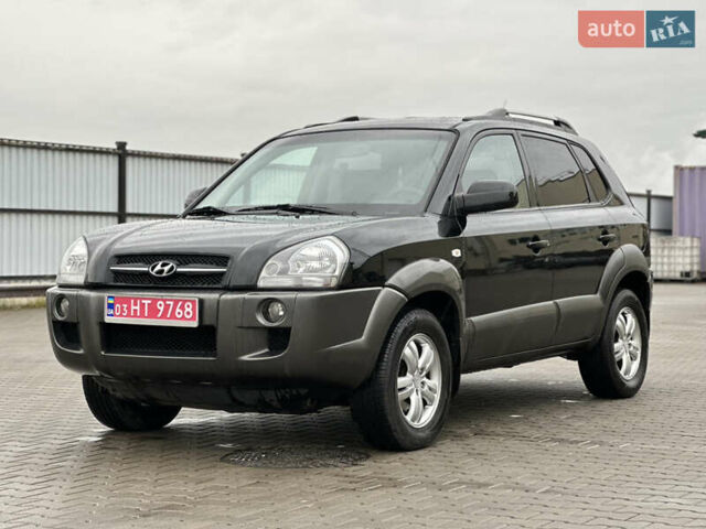 Чорний Хендай Туксон, об'ємом двигуна 2 л та пробігом 230 тис. км за 6850 $, фото 3 на Automoto.ua