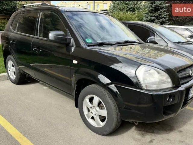 Черный Хендай Туксон, объемом двигателя 1.98 л и пробегом 273 тыс. км за 6100 $, фото 4 на Automoto.ua