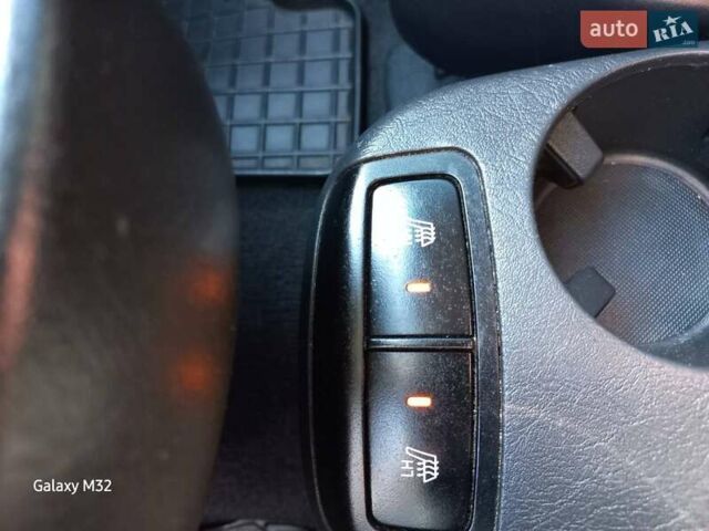 Черный Хендай Туксон, объемом двигателя 2 л и пробегом 219 тыс. км за 8500 $, фото 4 на Automoto.ua