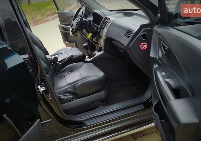 Чорний Хендай Туксон, об'ємом двигуна 2 л та пробігом 229 тис. км за 8600 $, фото 109 на Automoto.ua