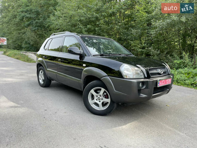 Черный Хендай Туксон, объемом двигателя 2 л и пробегом 174 тыс. км за 7600 $, фото 1 на Automoto.ua