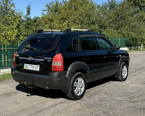 Черный Хендай Туксон, объемом двигателя 2 л и пробегом 294 тыс. км за 7500 $, фото 3 на Automoto.ua