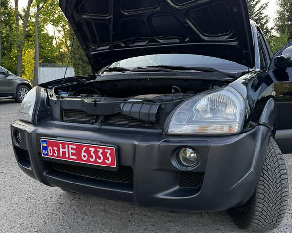 Черный Хендай Туксон, объемом двигателя 2 л и пробегом 239 тыс. км за 7850 $, фото 20 на Automoto.ua