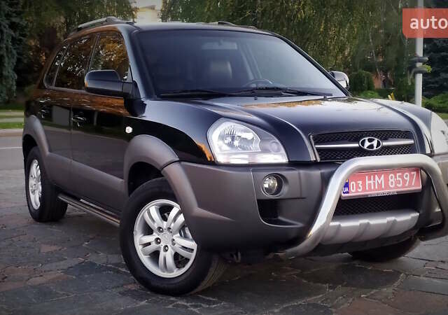 Черный Хендай Туксон, объемом двигателя 2 л и пробегом 230 тыс. км за 8600 $, фото 95 на Automoto.ua