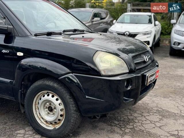 Черный Хендай Туксон, объемом двигателя 2 л и пробегом 177 тыс. км за 8940 $, фото 1 на Automoto.ua