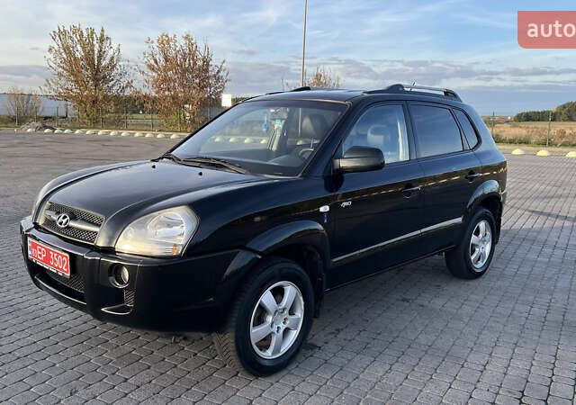 Черный Хендай Туксон, объемом двигателя 1.98 л и пробегом 243 тыс. км за 8500 $, фото 9 на Automoto.ua