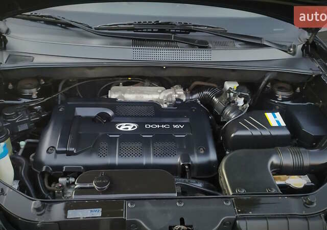 Черный Хендай Туксон, объемом двигателя 2 л и пробегом 230 тыс. км за 8600 $, фото 205 на Automoto.ua