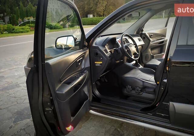 Черный Хендай Туксон, объемом двигателя 2 л и пробегом 230 тыс. км за 8600 $, фото 135 на Automoto.ua