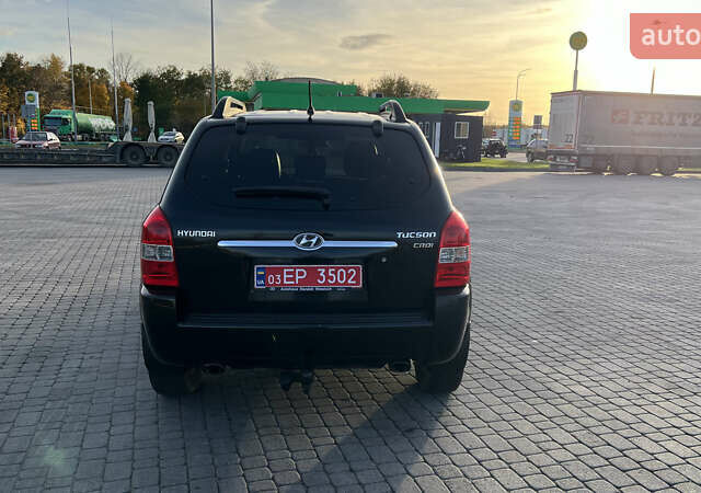 Черный Хендай Туксон, объемом двигателя 1.98 л и пробегом 243 тыс. км за 8500 $, фото 5 на Automoto.ua
