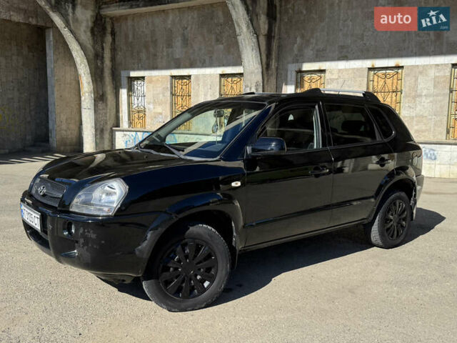 Черный Хендай Туксон, объемом двигателя 2 л и пробегом 189 тыс. км за 8250 $, фото 27 на Automoto.ua