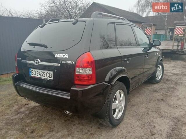 Черный Хендай Туксон, объемом двигателя 1.99 л и пробегом 235 тыс. км за 9000 $, фото 7 на Automoto.ua