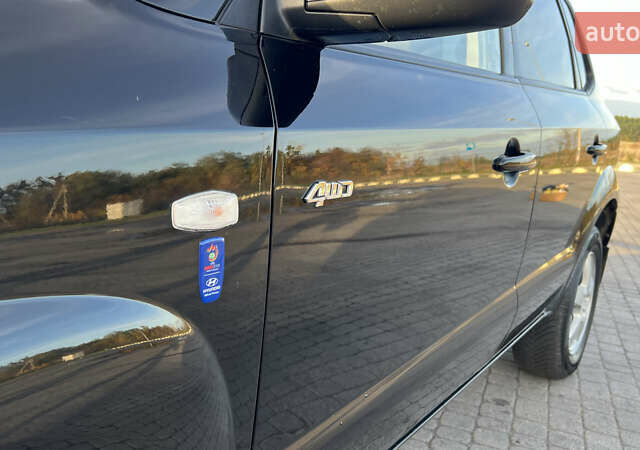 Черный Хендай Туксон, объемом двигателя 1.98 л и пробегом 243 тыс. км за 8500 $, фото 20 на Automoto.ua