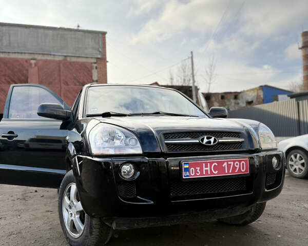 Черный Хендай Туксон, объемом двигателя 1.98 л и пробегом 230 тыс. км за 7750 $, фото 2 на Automoto.ua