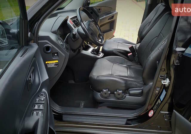 Чорний Хендай Туксон, об'ємом двигуна 2 л та пробігом 229 тис. км за 8600 $, фото 105 на Automoto.ua