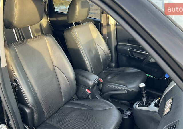 Черный Хендай Туксон, объемом двигателя 1.98 л и пробегом 243 тыс. км за 8500 $, фото 28 на Automoto.ua