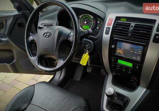 Чорний Хендай Туксон, об'ємом двигуна 2 л та пробігом 229 тис. км за 8600 $, фото 116 на Automoto.ua