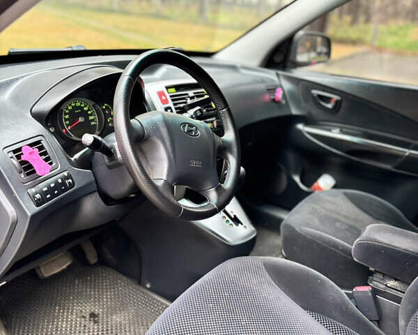 Черный Хендай Туксон, объемом двигателя 1.99 л и пробегом 266 тыс. км за 7500 $, фото 28 на Automoto.ua