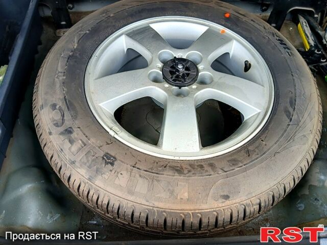 Черный Хендай Туксон, объемом двигателя 2 л и пробегом 235 тыс. км за 7900 $, фото 3 на Automoto.ua