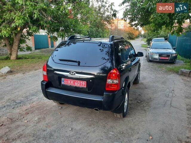 Черный Хендай Туксон, объемом двигателя 2 л и пробегом 219 тыс. км за 7990 $, фото 32 на Automoto.ua