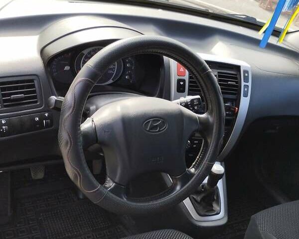 Черный Хендай Туксон, объемом двигателя 2 л и пробегом 250 тыс. км за 7500 $, фото 1 на Automoto.ua