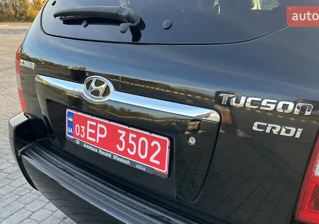 Черный Хендай Туксон, объемом двигателя 1.98 л и пробегом 243 тыс. км за 8500 $, фото 13 на Automoto.ua