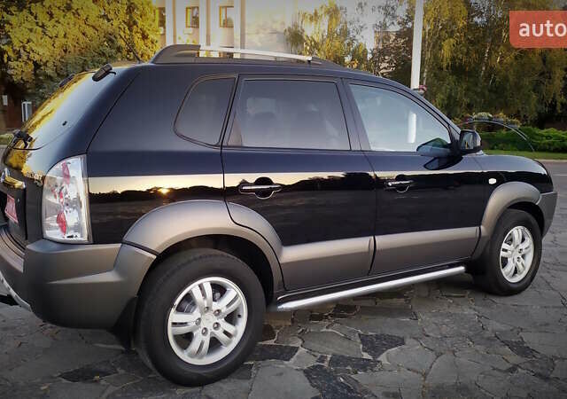 Черный Хендай Туксон, объемом двигателя 2 л и пробегом 230 тыс. км за 8600 $, фото 38 на Automoto.ua