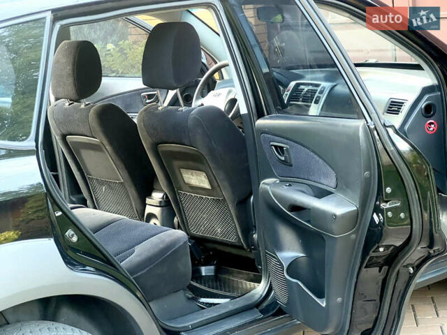 Чорний Хендай Туксон, об'ємом двигуна 1.98 л та пробігом 164 тис. км за 7950 $, фото 8 на Automoto.ua
