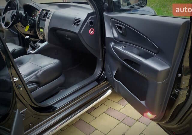 Чорний Хендай Туксон, об'ємом двигуна 2 л та пробігом 229 тис. км за 8600 $, фото 108 на Automoto.ua