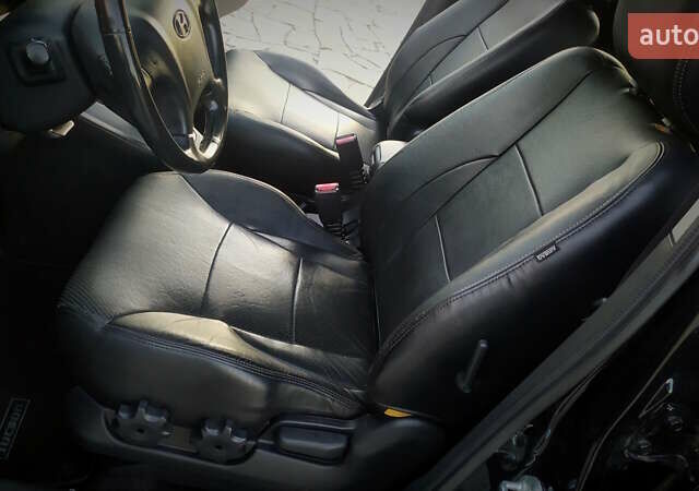 Черный Хендай Туксон, объемом двигателя 2 л и пробегом 230 тыс. км за 8600 $, фото 143 на Automoto.ua