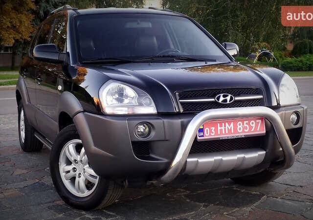 Черный Хендай Туксон, объемом двигателя 2 л и пробегом 230 тыс. км за 8600 $, фото 94 на Automoto.ua