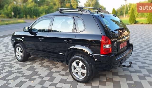 Черный Хендай Туксон, объемом двигателя 2 л и пробегом 190 тыс. км за 8150 $, фото 12 на Automoto.ua