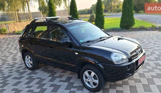 Черный Хендай Туксон, объемом двигателя 2 л и пробегом 190 тыс. км за 8150 $, фото 7 на Automoto.ua