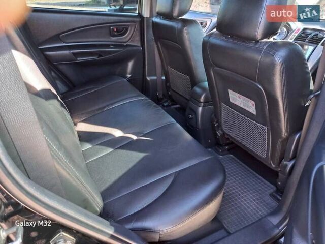 Черный Хендай Туксон, объемом двигателя 2 л и пробегом 219 тыс. км за 8500 $, фото 14 на Automoto.ua
