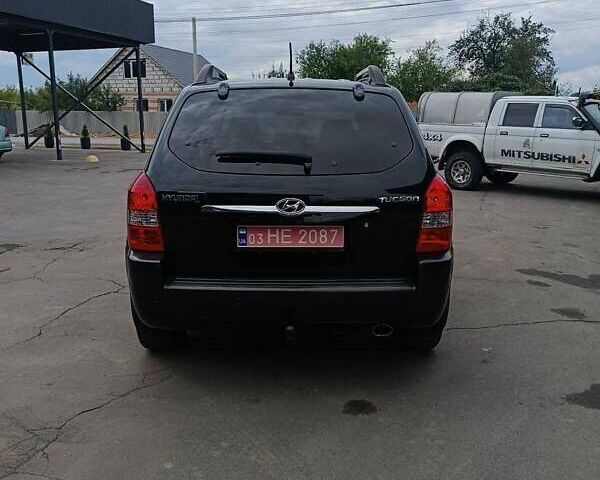 Черный Хендай Туксон, объемом двигателя 2 л и пробегом 255 тыс. км за 8400 $, фото 1 на Automoto.ua