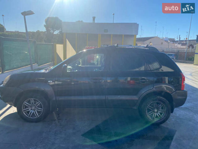 Чорний Хендай Туксон, об'ємом двигуна 1.98 л та пробігом 215 тис. км за 7540 $, фото 3 на Automoto.ua