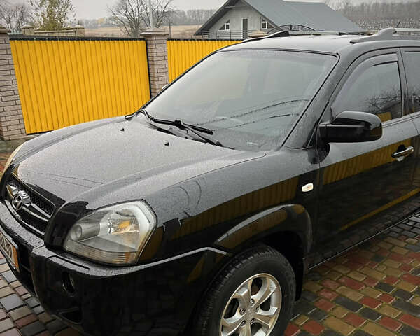 Черный Хендай Туксон, объемом двигателя 2 л и пробегом 151 тыс. км за 9100 $, фото 9 на Automoto.ua