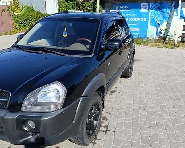 Черный Хендай Туксон, объемом двигателя 1.98 л и пробегом 275 тыс. км за 7800 $, фото 15 на Automoto.ua
