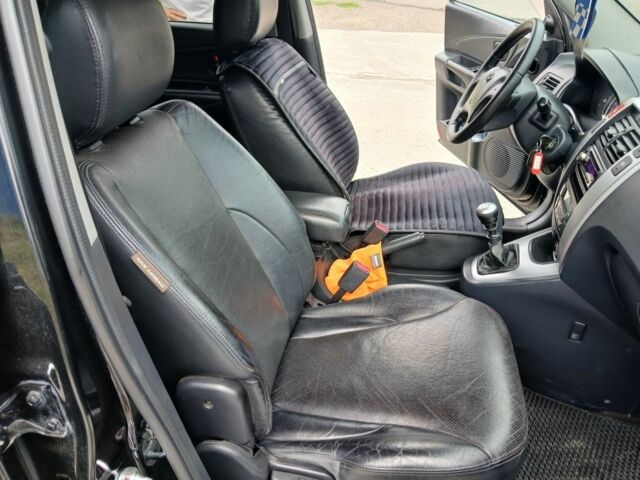 Чорний Хендай Туксон, об'ємом двигуна 2 л та пробігом 235 тис. км за 8000 $, фото 6 на Automoto.ua