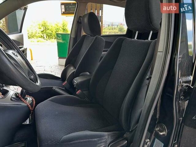 Черный Хендай Туксон, объемом двигателя 2 л и пробегом 310 тыс. км за 6499 $, фото 7 на Automoto.ua