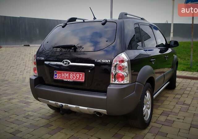 Чорний Хендай Туксон, об'ємом двигуна 2 л та пробігом 229 тис. км за 8600 $, фото 44 на Automoto.ua