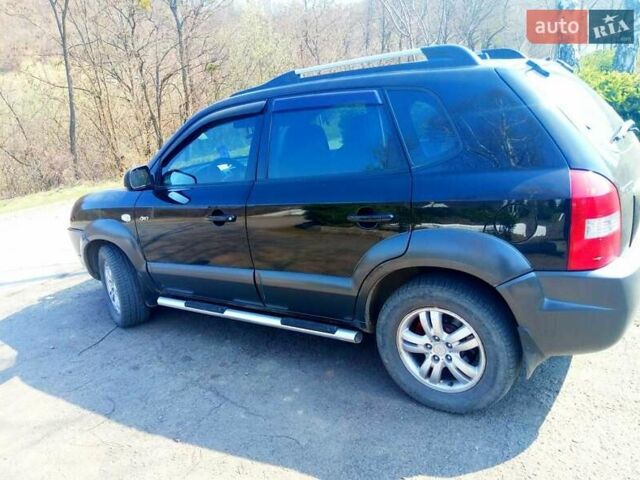 Черный Хендай Туксон, объемом двигателя 2 л и пробегом 218 тыс. км за 7700 $, фото 3 на Automoto.ua