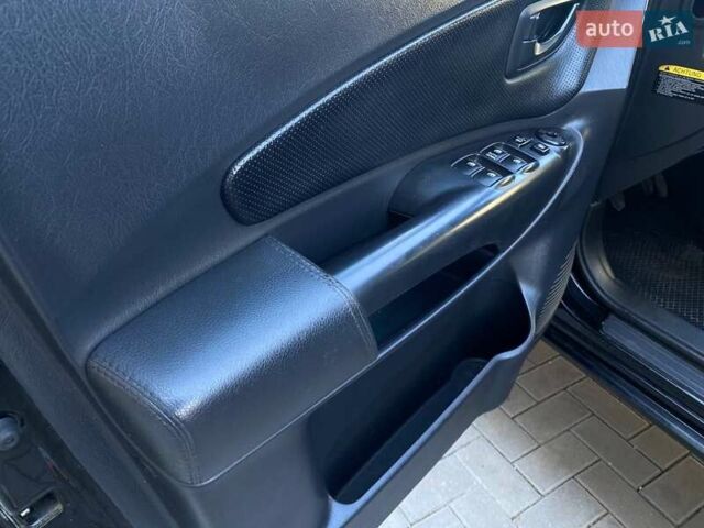 Черный Хендай Туксон, объемом двигателя 1.98 л и пробегом 286 тыс. км за 7300 $, фото 24 на Automoto.ua