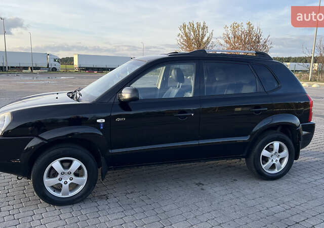 Черный Хендай Туксон, объемом двигателя 1.98 л и пробегом 243 тыс. км за 8500 $, фото 8 на Automoto.ua