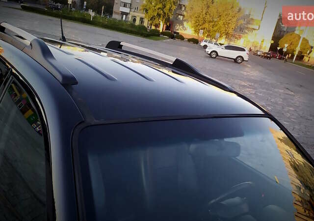 Черный Хендай Туксон, объемом двигателя 2 л и пробегом 230 тыс. км за 8600 $, фото 56 на Automoto.ua