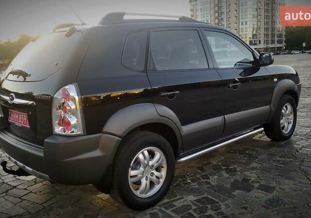 Черный Хендай Туксон, объемом двигателя 2 л и пробегом 230 тыс. км за 8600 $, фото 20 на Automoto.ua