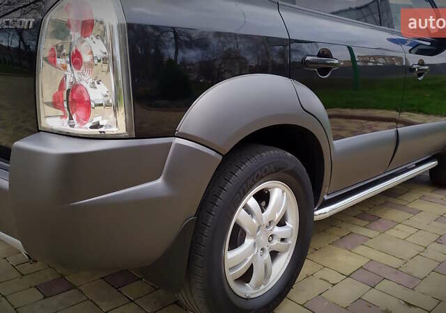 Чорний Хендай Туксон, об'ємом двигуна 2 л та пробігом 229 тис. км за 8600 $, фото 70 на Automoto.ua